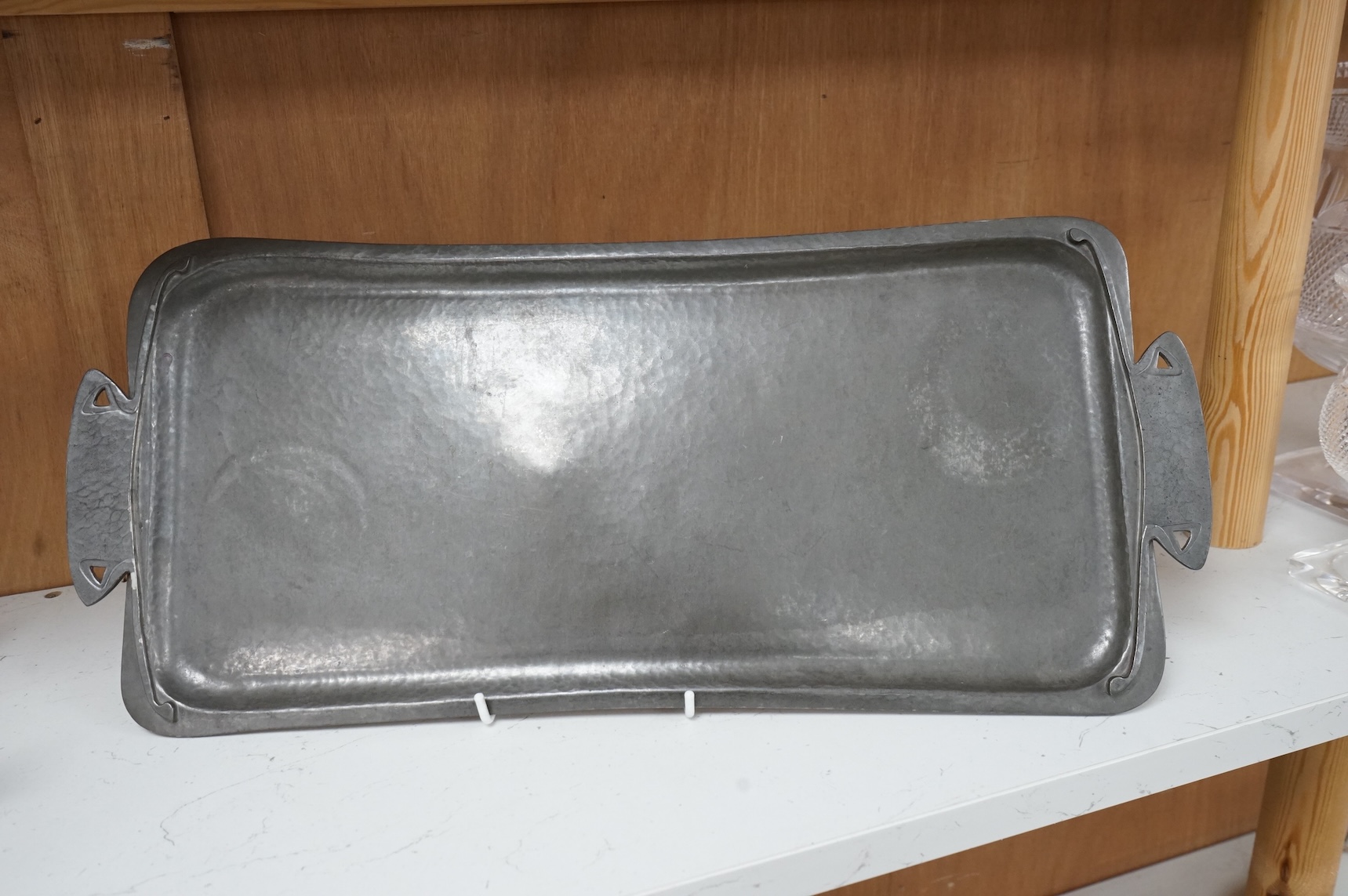 An Art Nouveau Liberty Tudric rectangular pewter tray, stamped and numbered 01671 to the base, 50cm wide